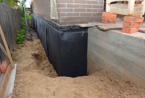SJ Waterproofing Pros technician performing targeted Interior Drainage System assessment in Concord, AL